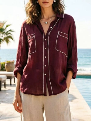 Burgundy linen shirt with white piping, long sleeves, and two chest pockets.
