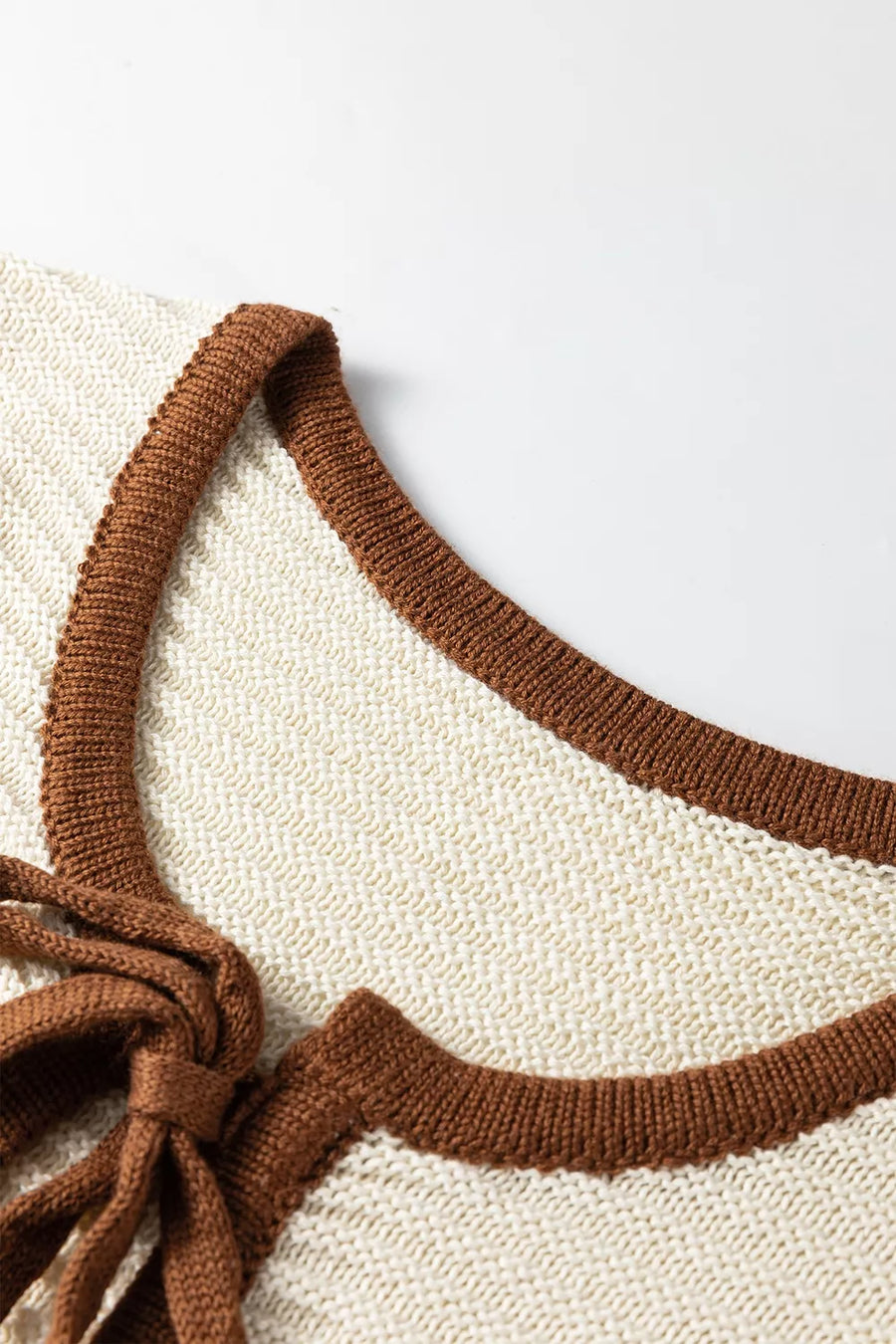sweater vest in ivory with tied and waist-length