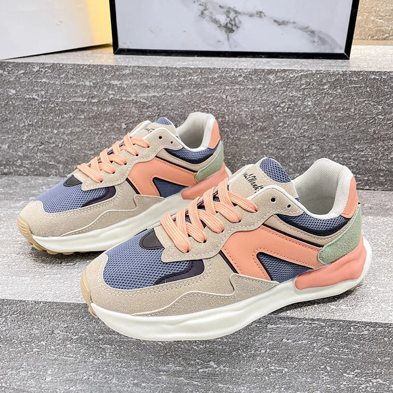 Panelled retro runner sneakers in beige, peach, blue, and green with white soles.