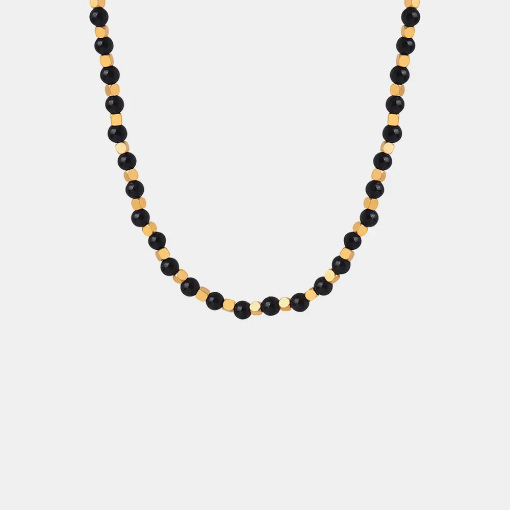 Black onyx and gold bead necklace with 18K gold accents.