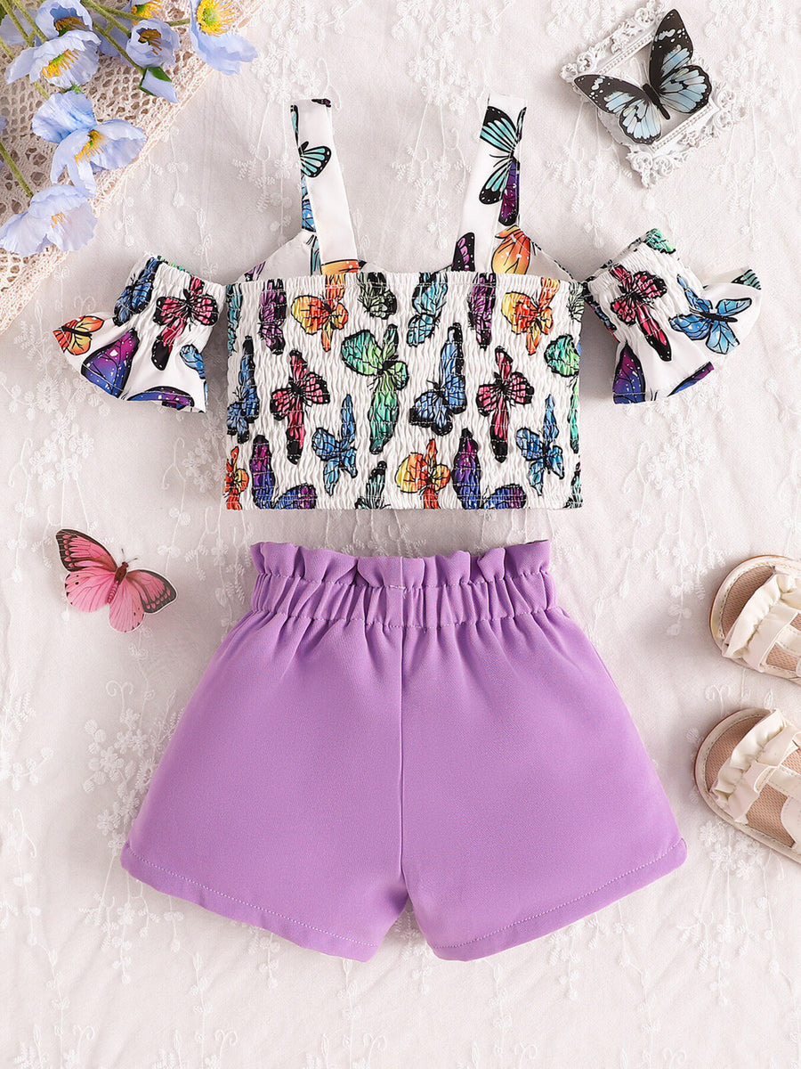 Baby girl butterfly print smocked crop top with cold shoulder sleeves and purple ruffled shorts.