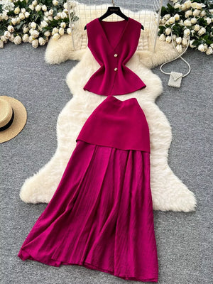 Wine red sheer two-piece set with button details, V-neck sleeveless top and flowing skirt.