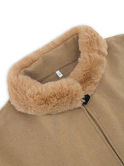 Tan cape coat with faux fur trim and a black button closure.