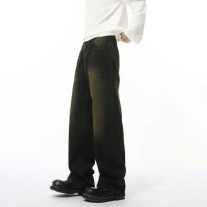 Dark wash wide-leg distressed denim jeans with a relaxed fit.