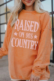 90s country graphic corded sweatshirt in sherbet with a relaxed fit and crew neck.