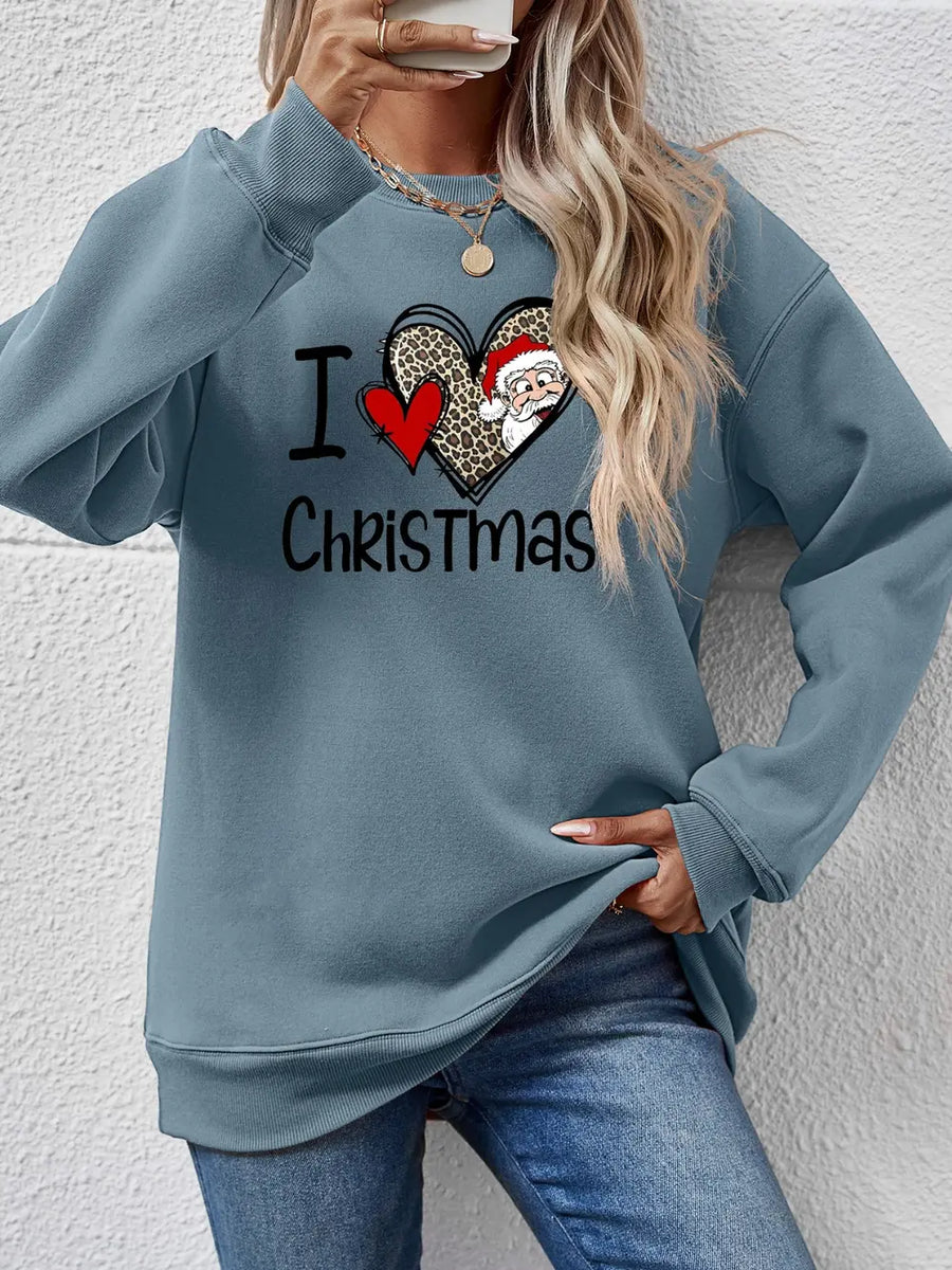 Light blue crewneck sweatshirt with festive I Love Christmas heart graphic featuring Santa.