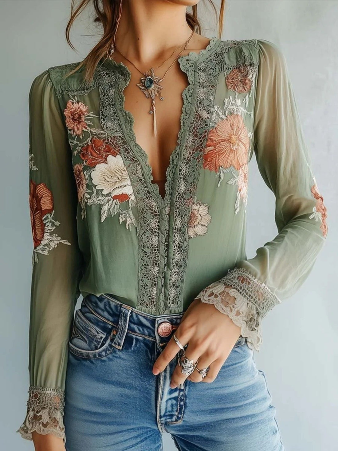 Green floral embroidered lace blouse with bishop sleeves and deep V-neck