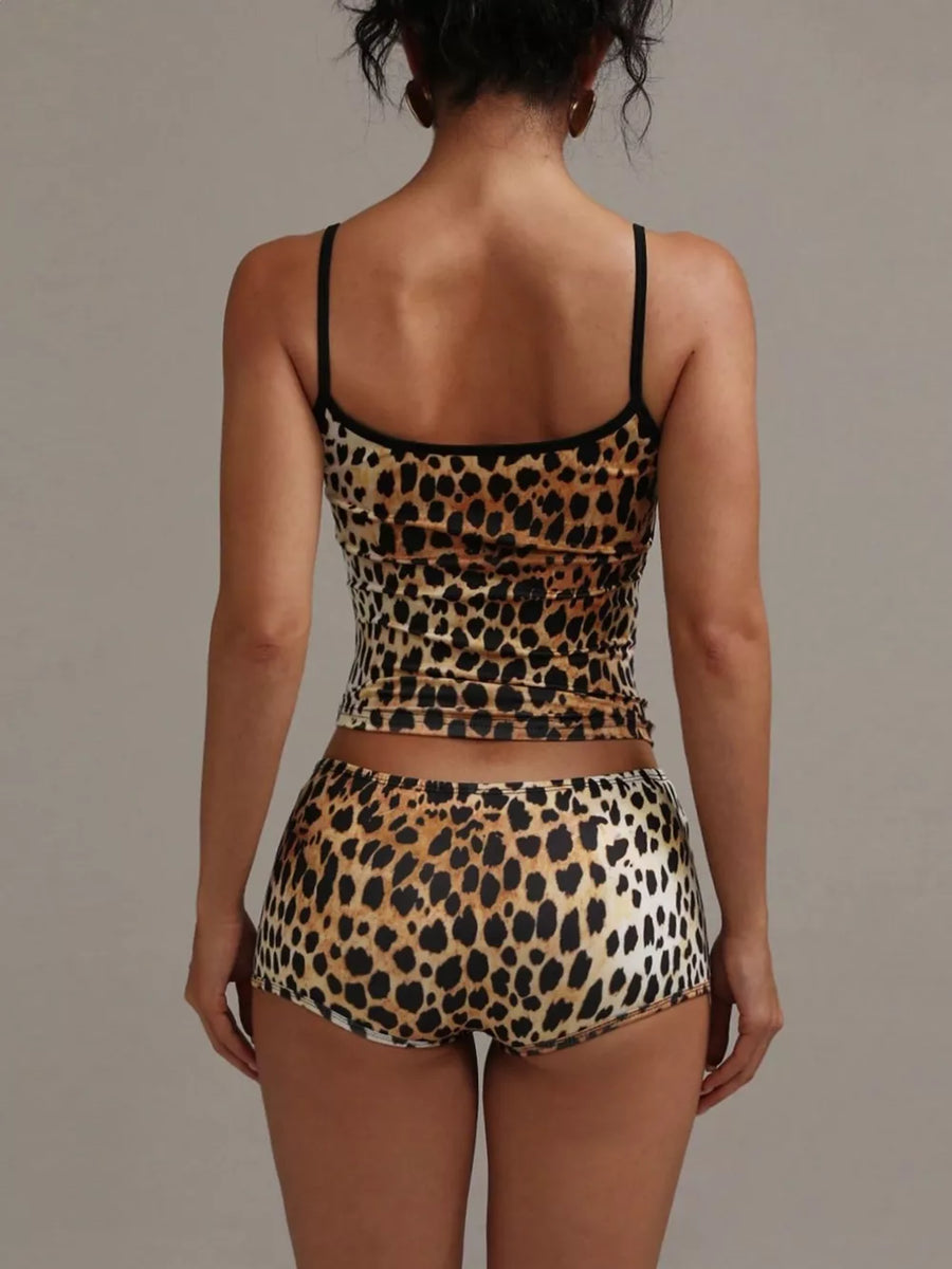Women's leopard print cami and shorts pajama set with adjustable straps.