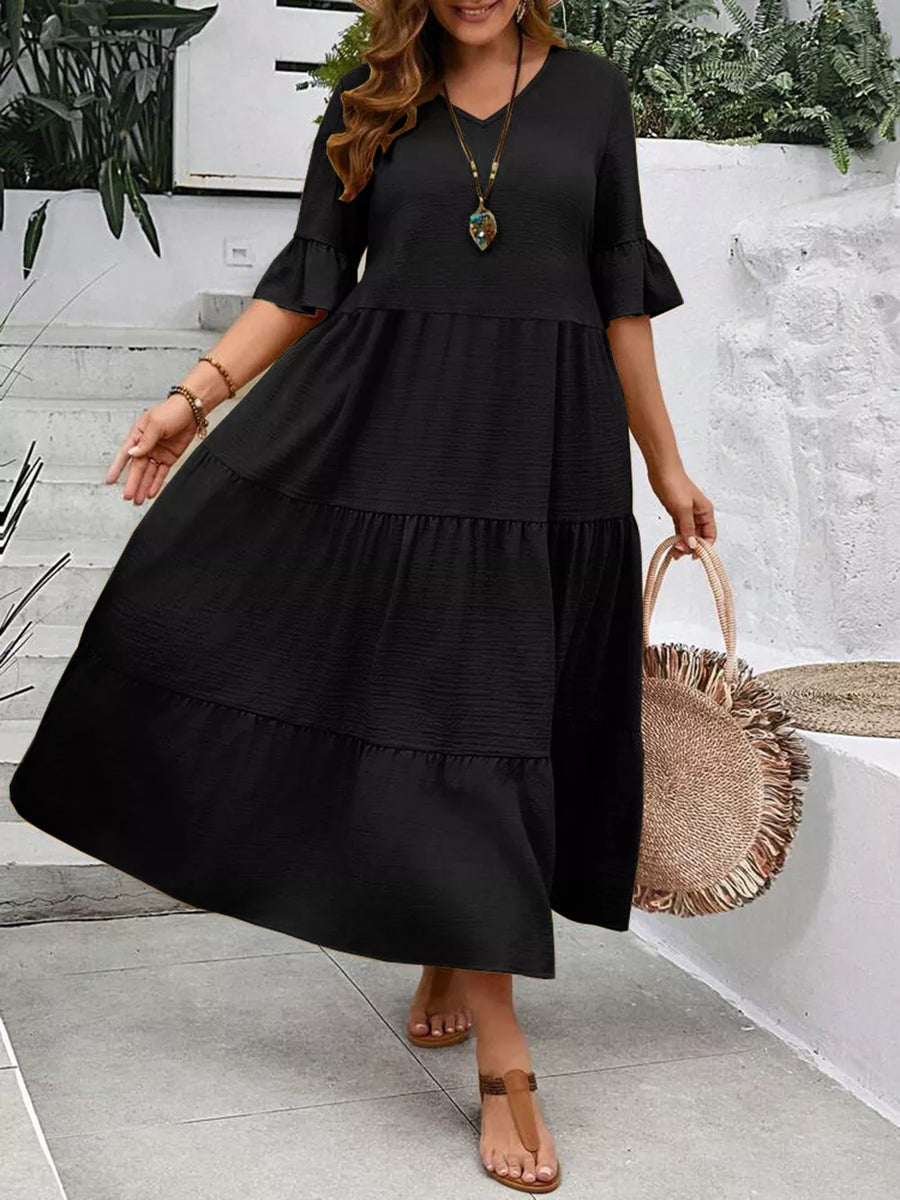 Black tiered midi dress with ruffle sleeves and V-neck, crinkled fabric, casual style