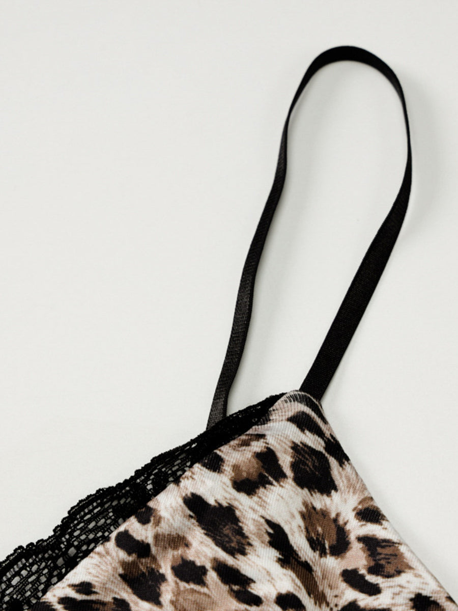 Leopard print cami top with black lace trim and adjustable spaghetti straps.