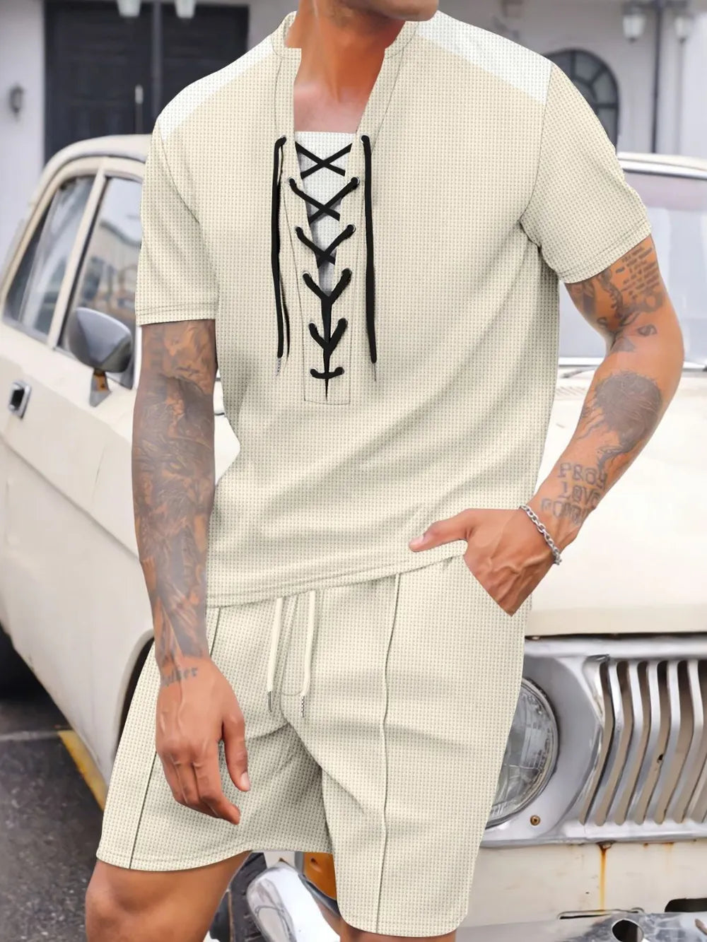 Ivory waffle knit lace-up lounge set with shorts and short sleeves.
