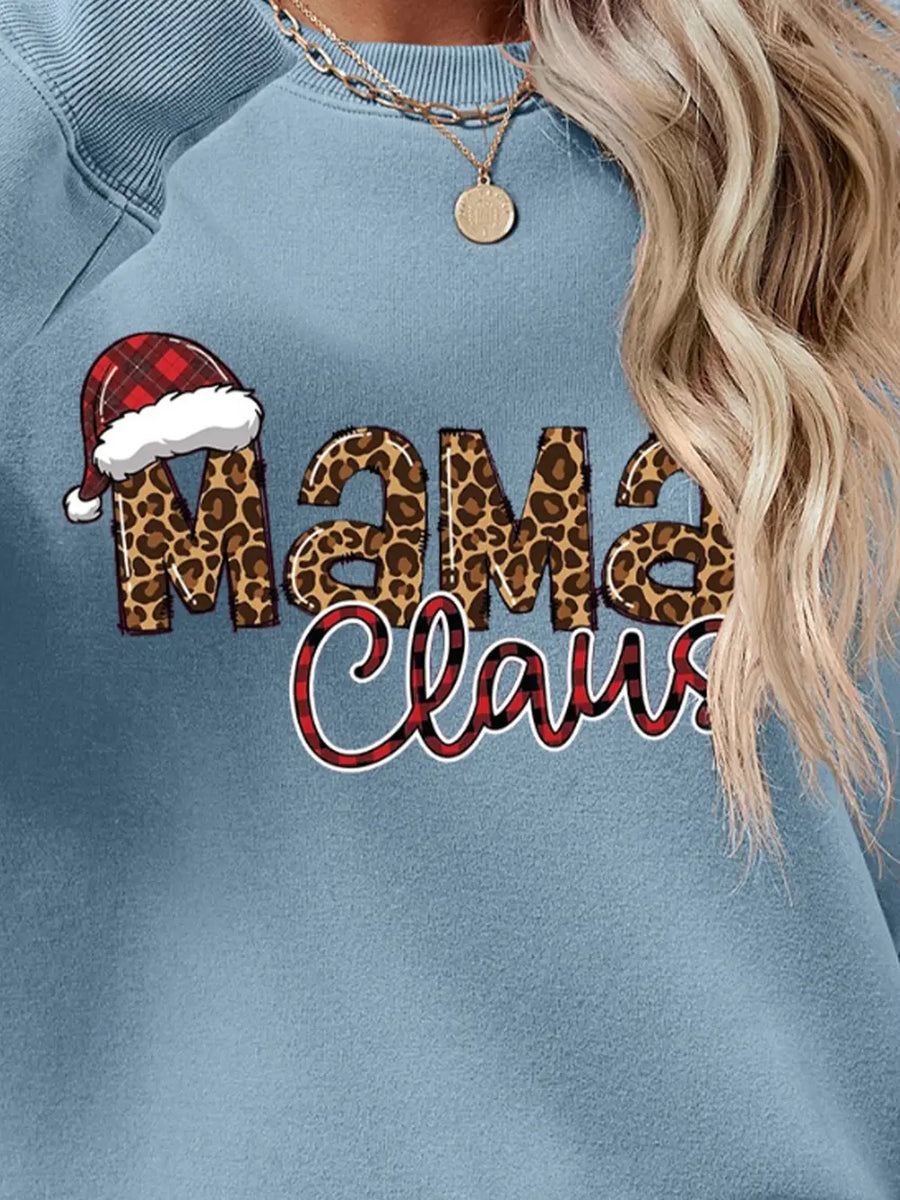 French Blue crewneck sweatshirt with leopard print "Mama" and plaid "Claus" text, plus Santa hat detail.