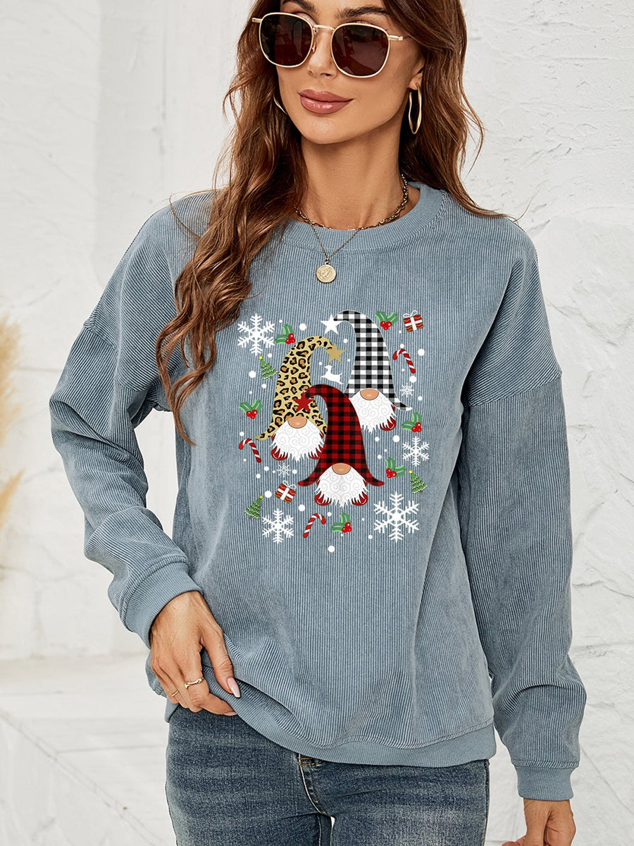 Light Blue corduroy sweatshirt with a gnome graphic featuring plaid and leopard patterns, snowflakes, and candy canes.