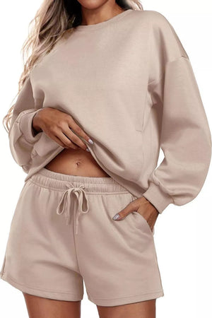 Cozy two-piece sweatshirt set in tan with drawstring shorts and crewneck sweatshirt.