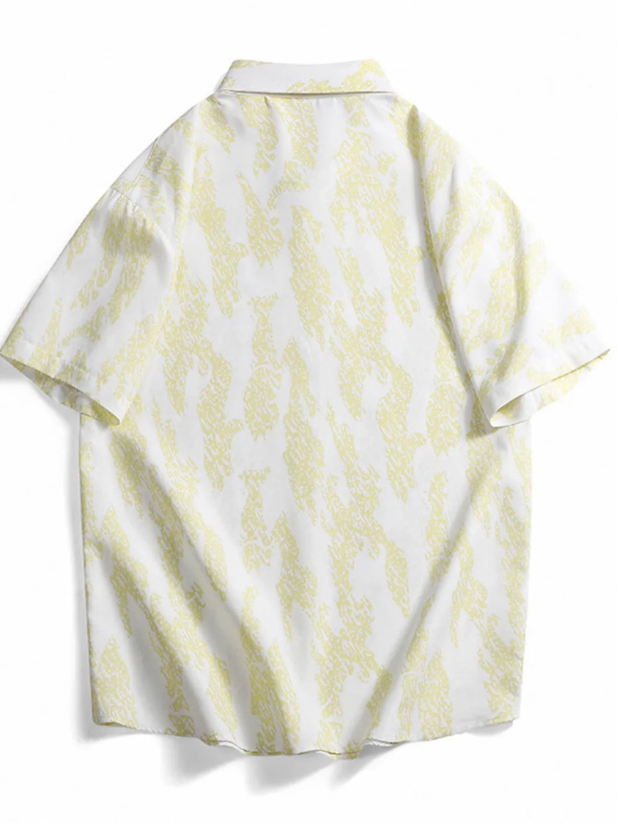Cotton button-up shirt in white with abstract neon yellow pattern.