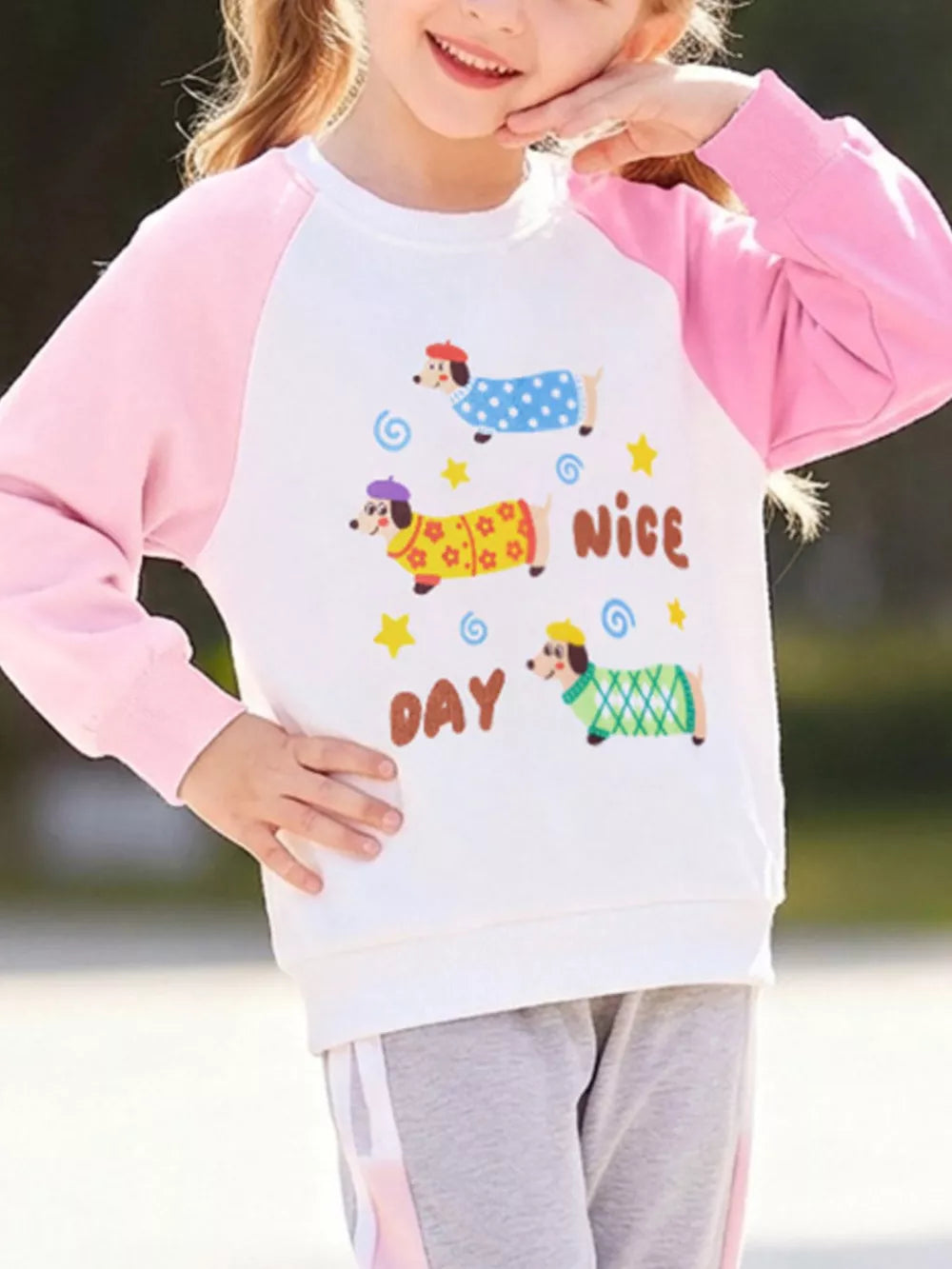 white sweatshirt with graphic print and crew neck