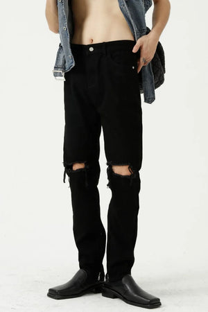 Black denim jeans with distressed knees and a modern straight leg cut.