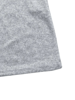 Light Gray knit maxi dress detail showing hem and fabric texture.