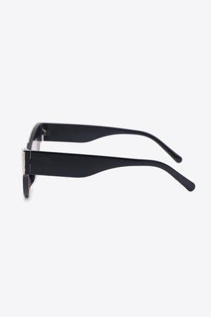 Black cat-eye sunglasses with crystal embellishments on the frames