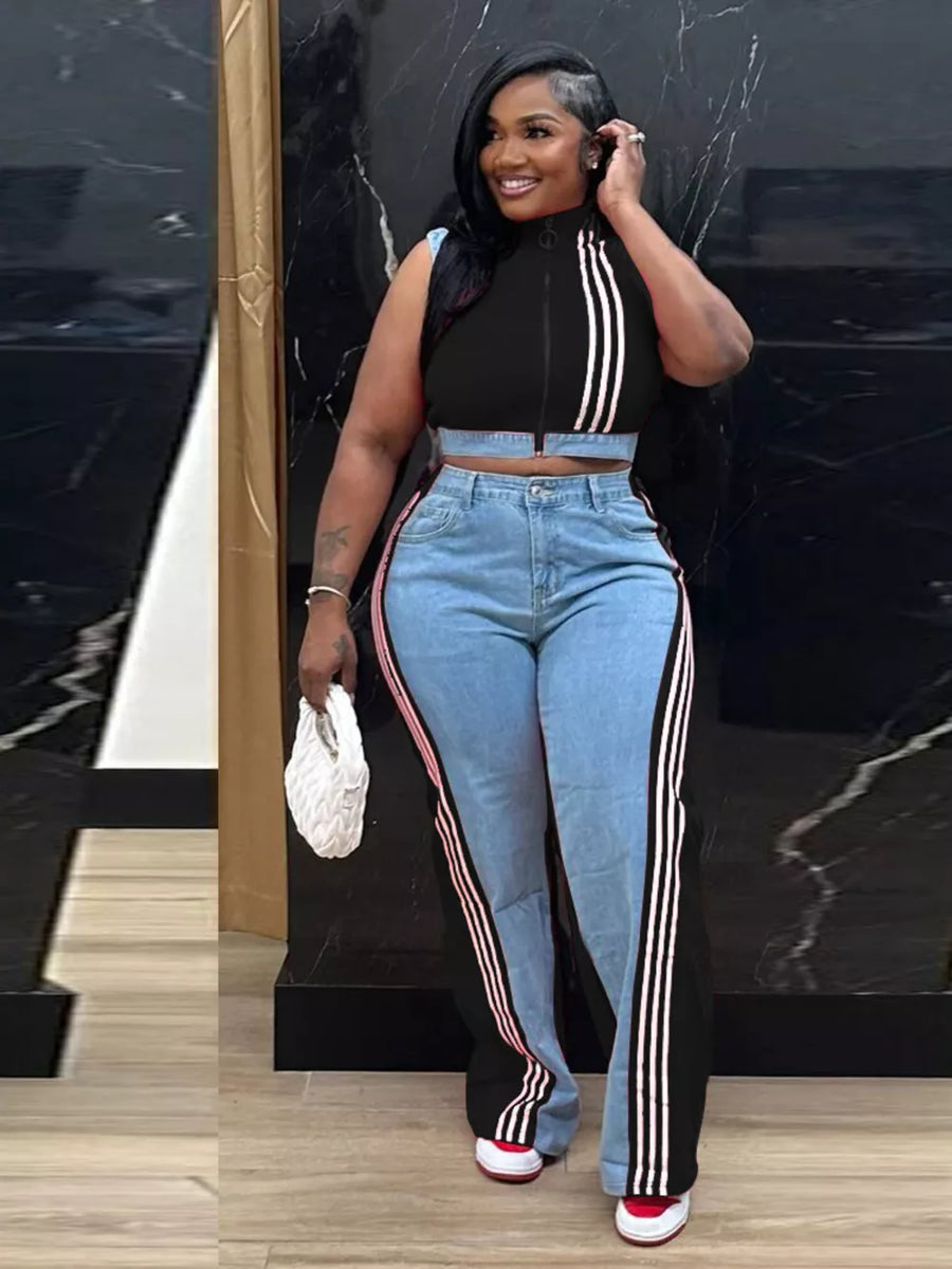 Black zip-front crop top with white stripes and wide-leg jeans with side stripes.