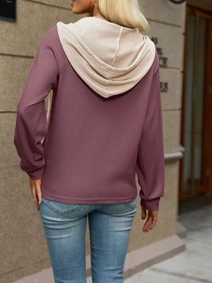 Mauve hoodie featuring buttoned placket and waffle-knit