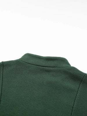Dark green half zip sweatshirt with stand collar and ribbed sleeve detail.