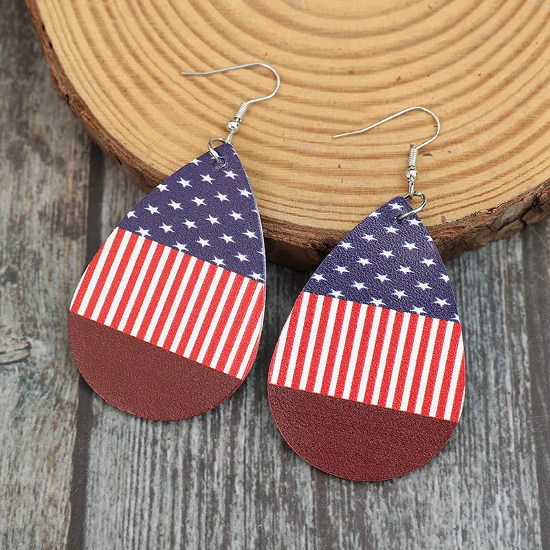 Patriotic faux leather teardrop earrings with American flag pattern in deep red.