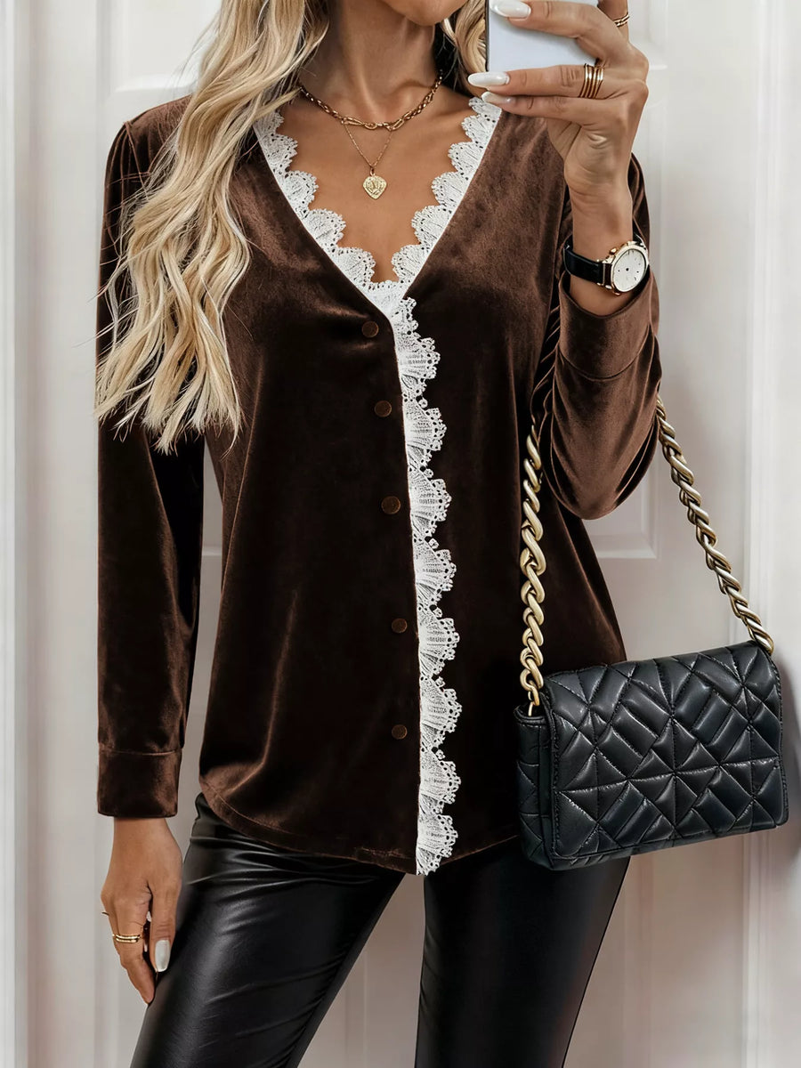 Brown velvet V-neck blouse with white lace trim and button front.