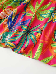 Tropical print midi dress in strawberry pink with smocked detail and tie straps.