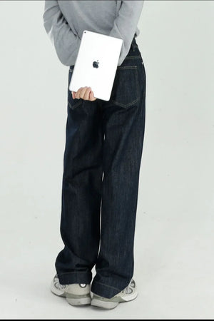 Dark wash wide-leg denim jeans with a relaxed fit, shown from the back.