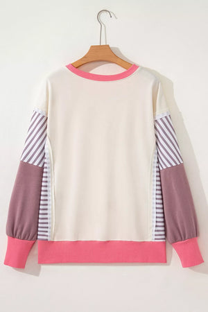 65% polyester, 35% cotton Care instructions: Machine wash cold sweatshirt in mauve with relaxed silhouette