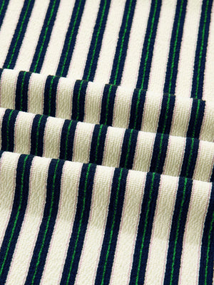 Striped knit top in navy, green, and pink with a textured weave.
