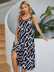 Graphic print midi dress in black and white with ruffled straps and tiered skirt.