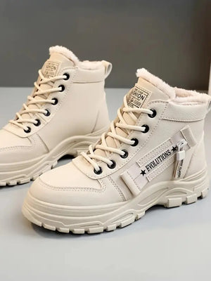 Tan platform boots with faux shearling lining and side zipper detail.