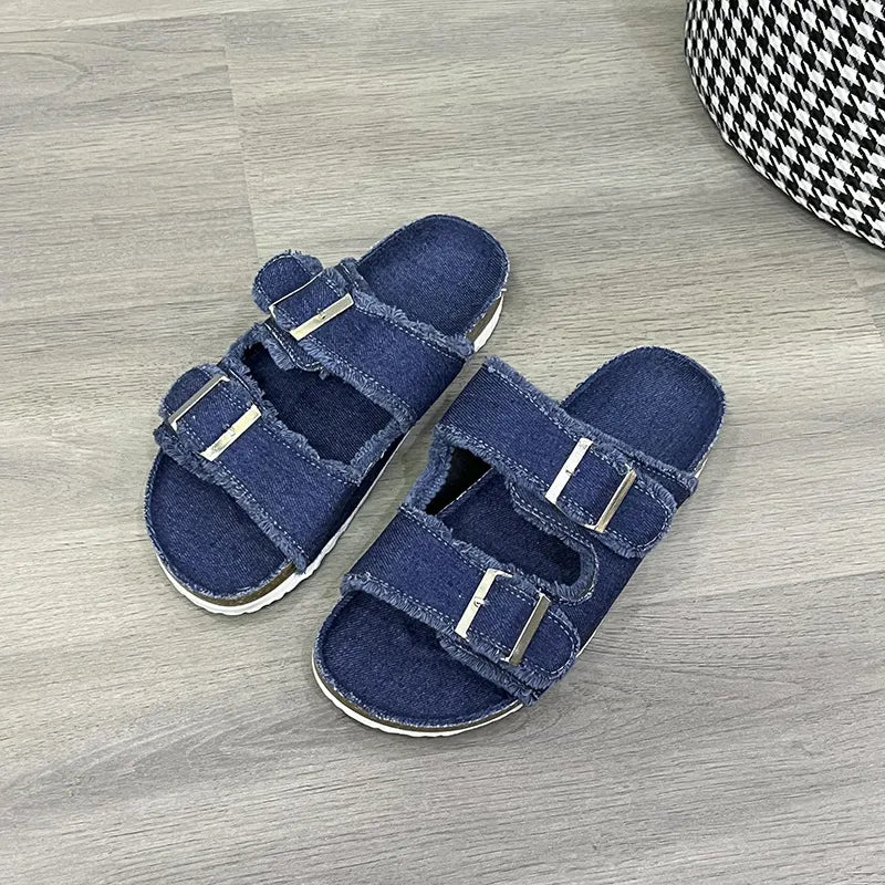 Denim buckle slides with frayed edges in blue.
