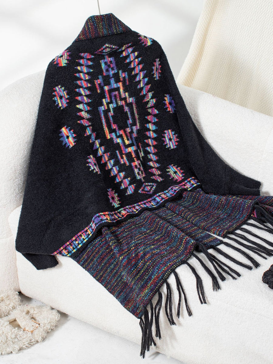 Black Aztec fringe knit cardigan with colorful geometric pattern and fringed hem.