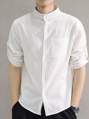 White cotton casual shirt with roll-up sleeves and chest pocket.