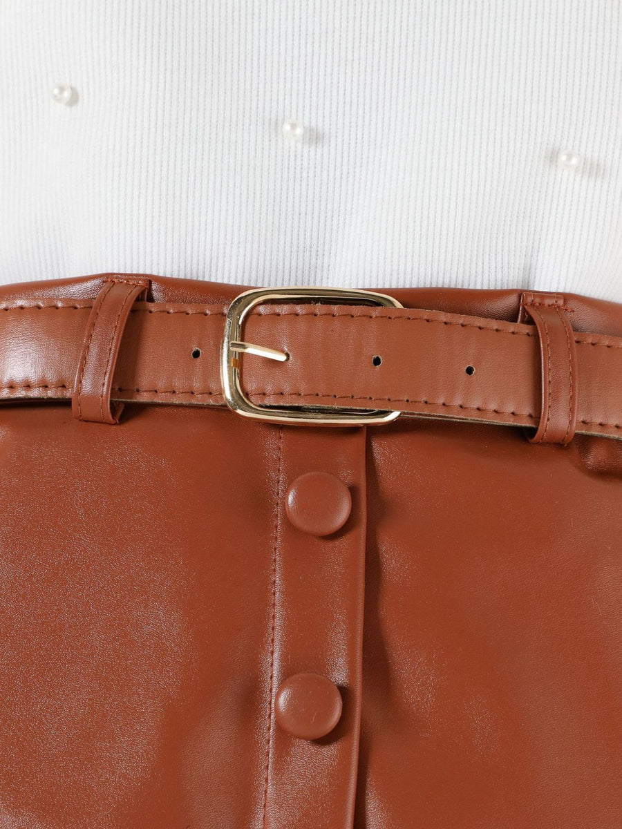Toddler white pearl-embellished top with brown faux leather skirt, belt, and button detail.