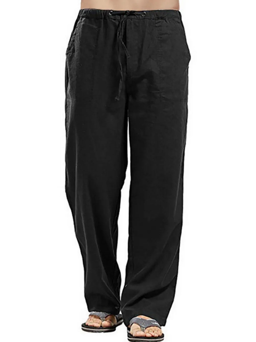 Black linen drawstring trousers with a relaxed fit and side pockets.