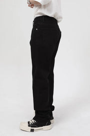 Dark relaxed fit denim jeans with zip hem detail.