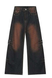 Faded wash palazzo jeans in dark denim with stud details on the sides.