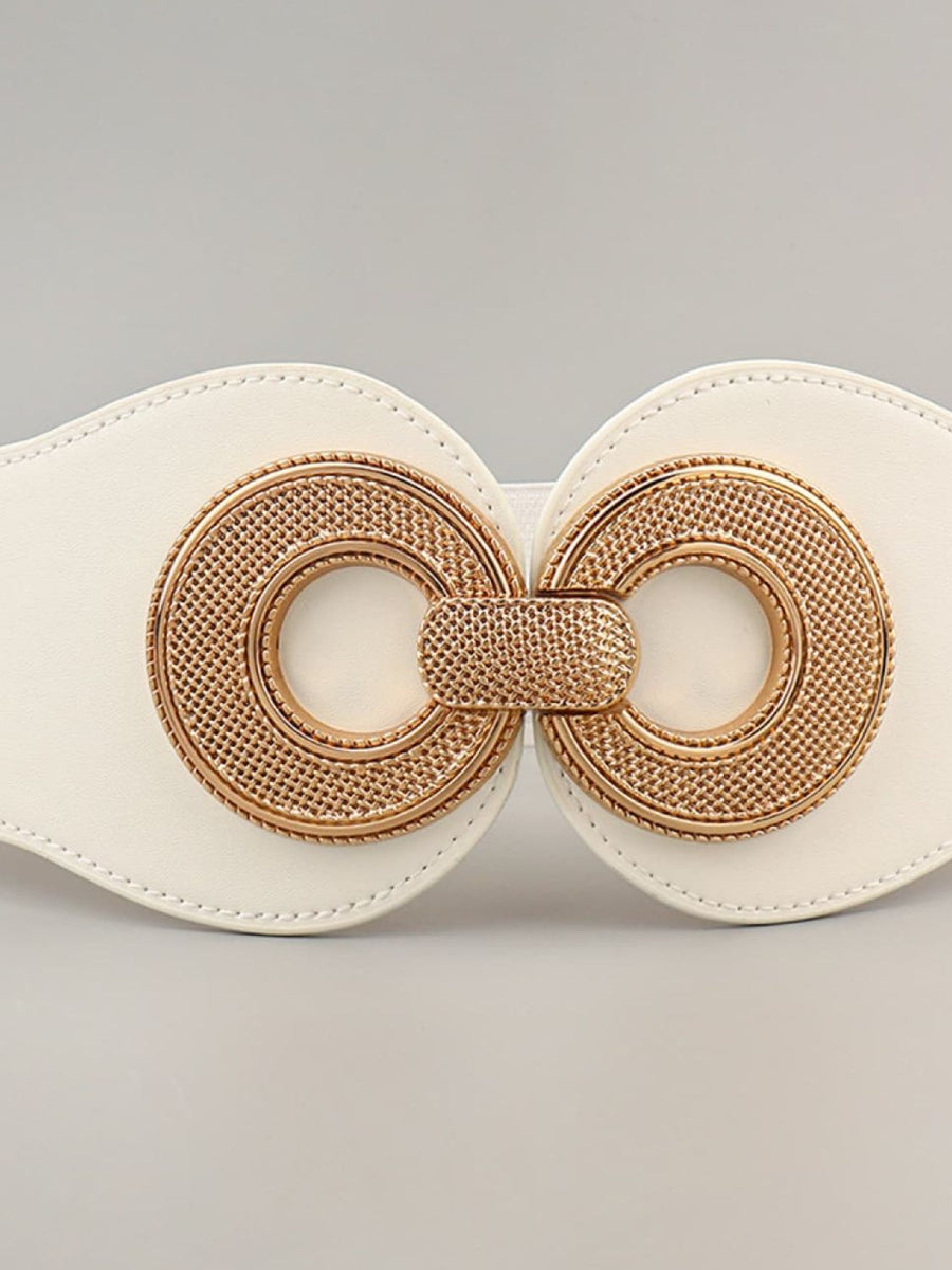 White leather belt with ornate gold metalwork buckle detail