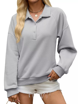 sweatshirt in slate gray featuring buttoned placket and relaxed fit