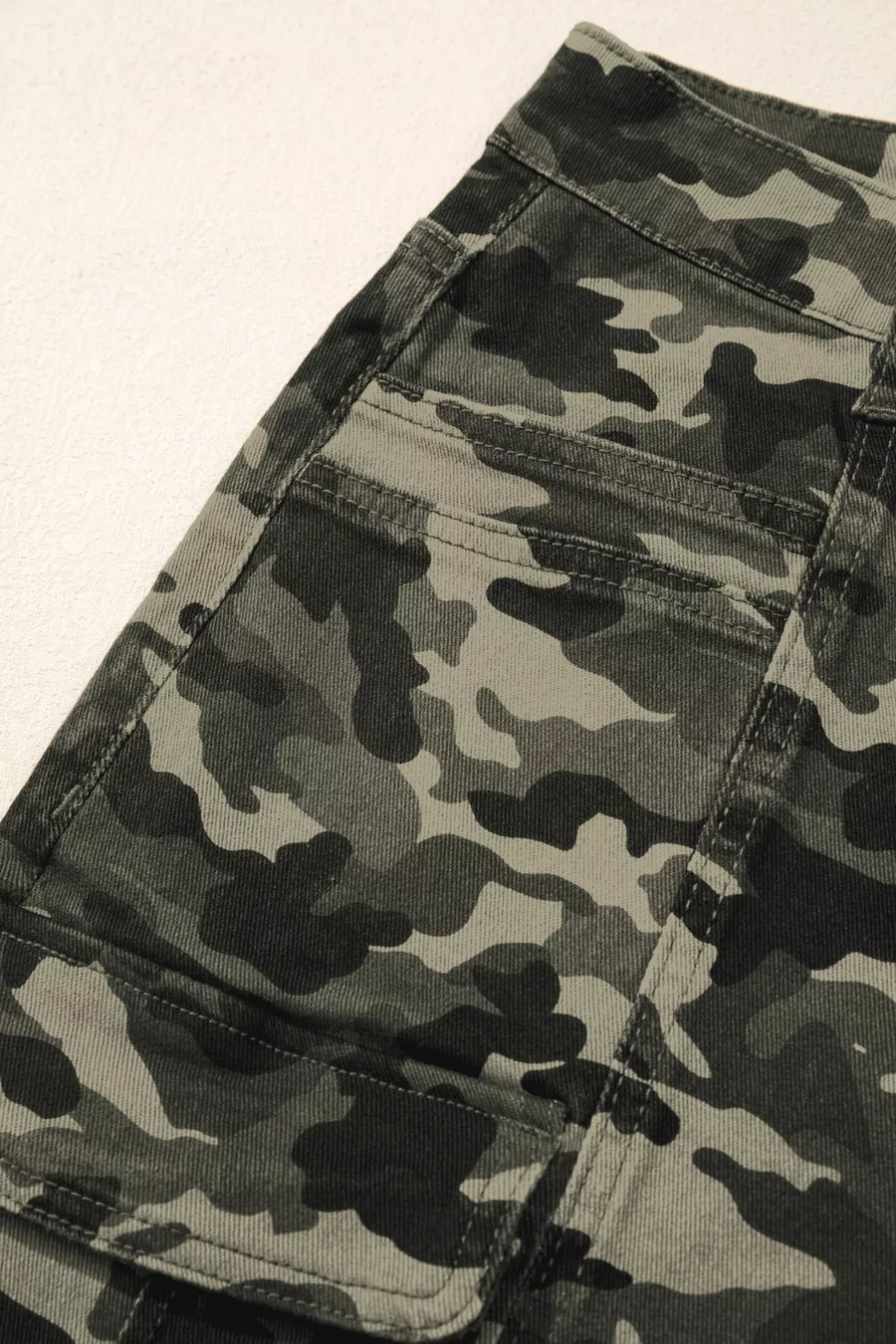 Women's camo print cotton cargo jeans with utility pockets.