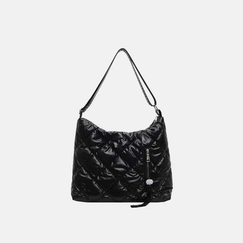 Black diamond quilt padded shoulder bag with a zippered pocket and tassel detail.