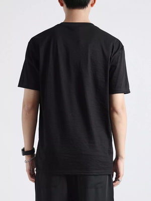 Black cotton t-shirt with relaxed fit and crew neck, shown from the back.