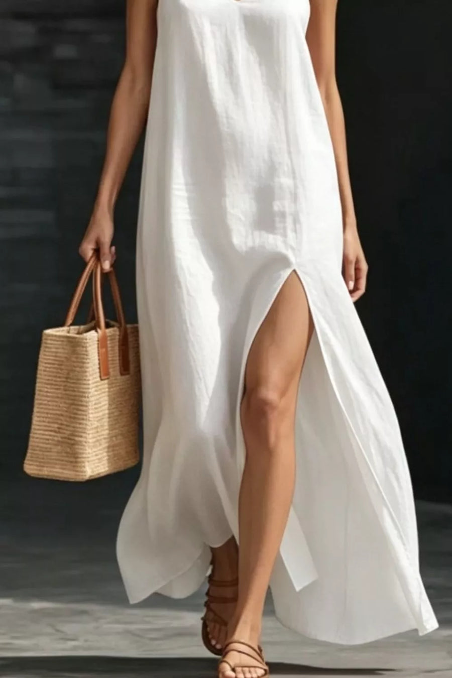 White V-neck maxi dress with a high slit, sleeveless, breezy casual style.