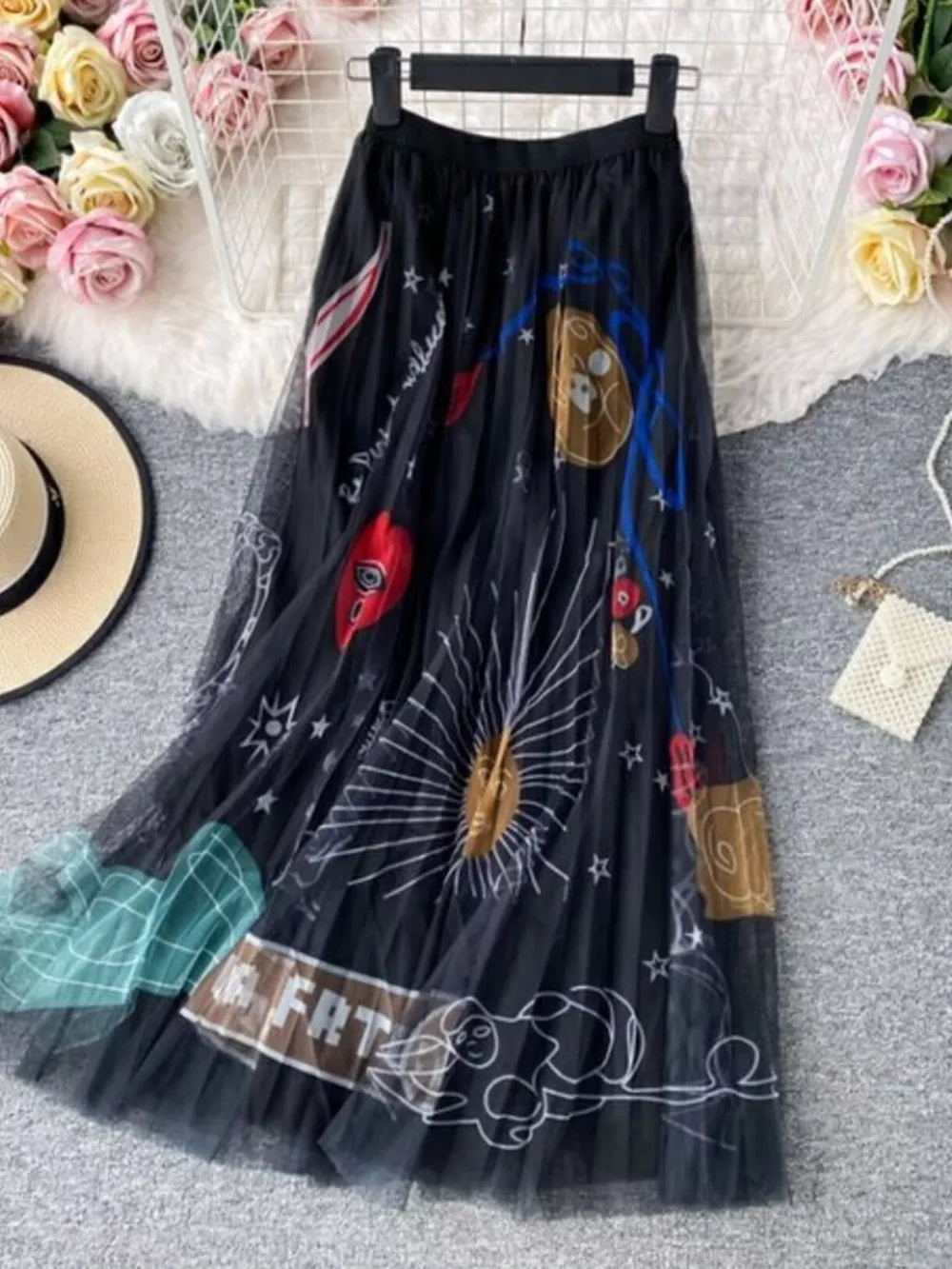 Black tulle midi skirt with whimsical sunburst and abstract print