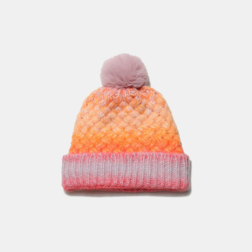 Textured ombre knit beanie with pom in pink and orange gradient colors