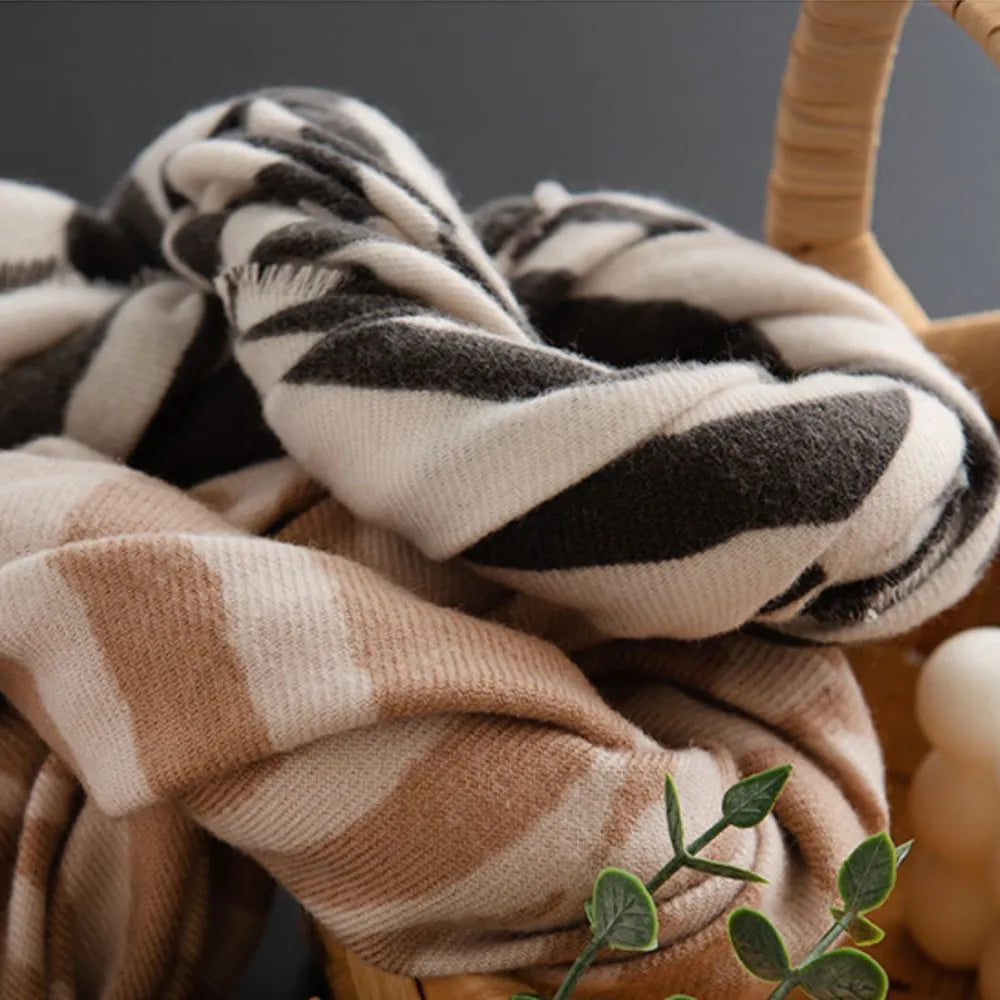 Zebra stripe wool scarf in khaki and black with fringed edges.